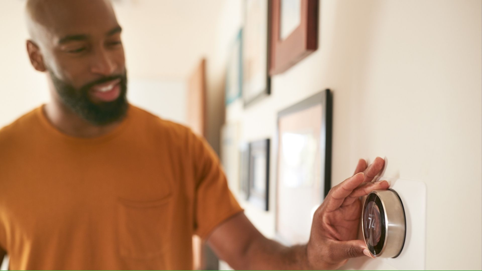 Man turning up thermostat