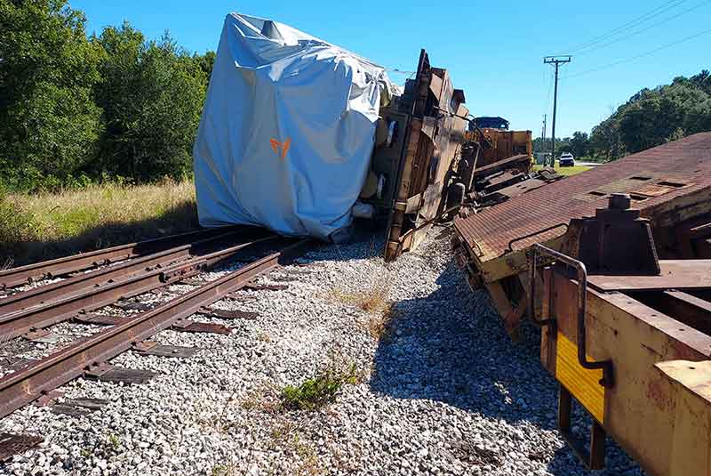 Close up of MAN Engine on it side and train derailment 